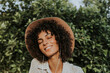 © Rawpixel.com - Beautiful woman listening to music in a botanical garden