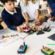 © Rawpixel.com - Young students learning coding and programming in school