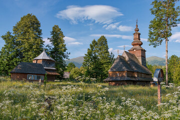 Old wooden church against blue sky, historic architecture, religion background