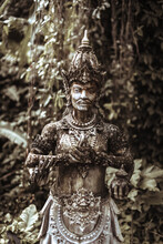 Balinese Statue Stone Figure Of The God. Water Palace Of Tirta Gangga In East Bali, Indonesia.