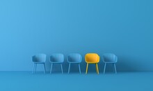 Empty Chairs And Table Against Blue Wall