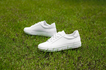 White sneakers on the grass