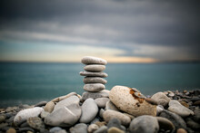 Stack Of Stones On Beach Against Sky