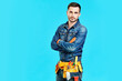 © GVS - Portrait of confident handsome male construction worker with crossed arms and copy space