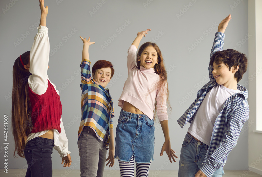 Happy boys and girls having fun. Group of energetic primary school ...