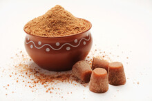 Jaggery Powder With Jaggery Cubes. Jaggery Is Used As An Ingredient In Sweet And Savoury Dishes In The Cuisines Of India.
