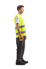 Poster - Full length shot of a young waste collector in a uniform and gloves