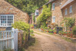 © Stephen - Traditional stone cottages on a quaint country lane in the charming rural English village of Abbotsbury, Dorset, England, UK.