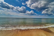 Panoramic dramatic sunset sky and tropical sea at dusk. Beach sand, sea and blue sky with clouds