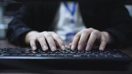 programmer man hand typing on keyboard at computer desktop for working about maintenance plan in the night time at office operation room for development of technology and software system concept