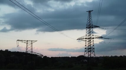 Wall Mural - poles and power lines at sunset