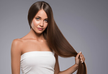 Wall Mural - Beautiful woman with long beautiful smooth hair natural make up healthy skin