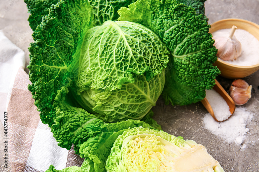 Fresh savoy cabbage on grunge background, closeup