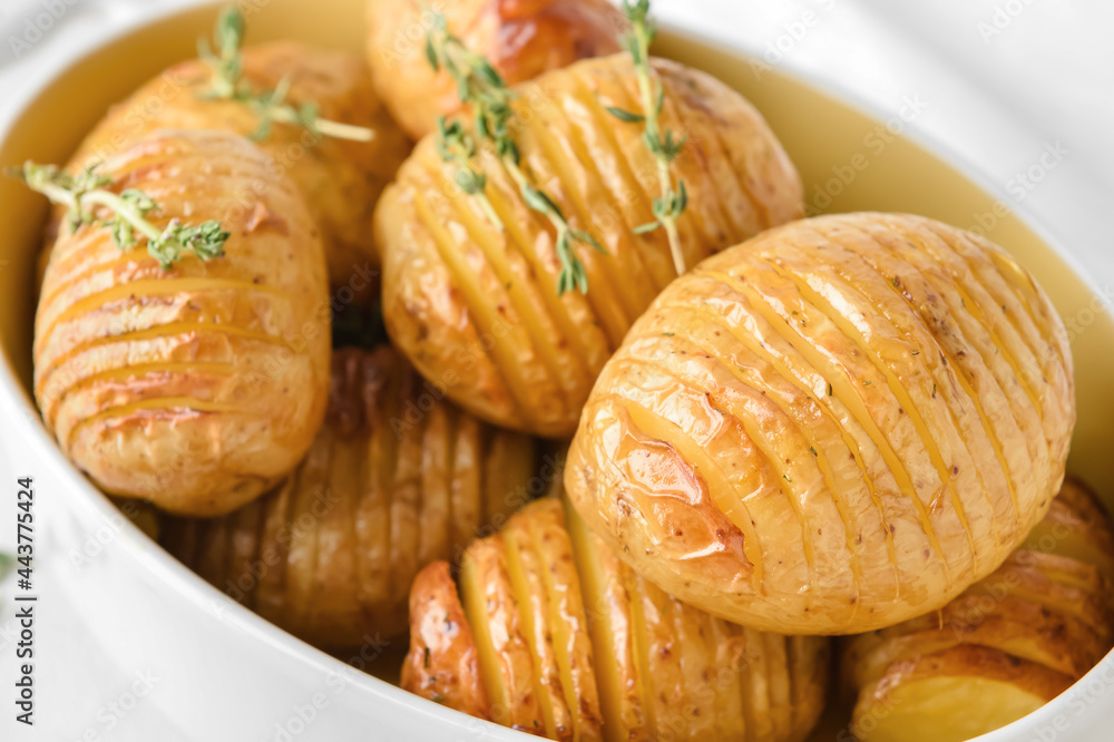 Dish with tasty baked potato, closeup