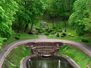 Wall Mural - beautiful green spring park with blooming tulips