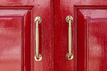 Wall Mural - Gold aluminum door handle and red wood door