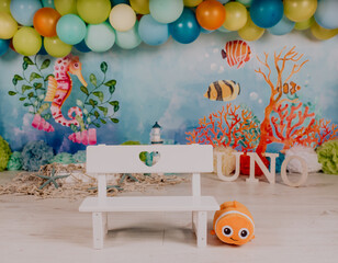 First birthday smashcake photo session of an under the sea and little mermaid theme in a photo studio