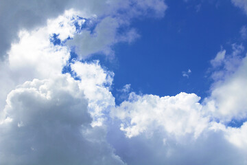 Beautiful blue sky and large white cumulus clouds. Background. Scenery. Texture.