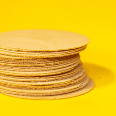 amaranth wafers isolated on a yellow background. a typical sweet from mexico and latin america.