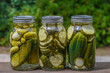 3 Jars of homemade dill pickles outside
