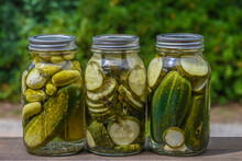 3 Jars Of Homemade Dill Pickles Outside