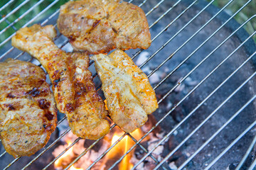 Sticker - Chuck steaks being barbequed outdoors
