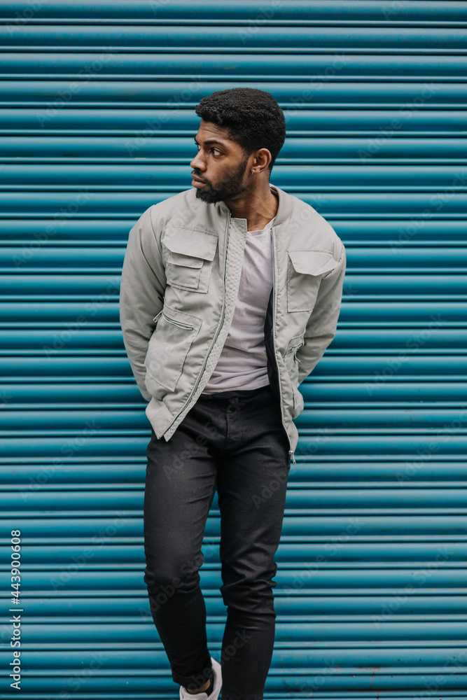 Good looking young black man in trendy fashion urban street clothes looking stylish trendy and urban Stock Photo Adobe Stock