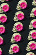 Skull pattern with pink flower.  Creative Halloween background. Minimal romantic fashion koncept.