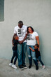 © Erin Brant/Stocksy - Black daughters hugging tall parents