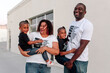 © Erin Brant/Stocksy - Happy Black family in t-shirts