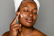 © McKinsey Jordan/Stocksy - Woman Applying Face Lotion