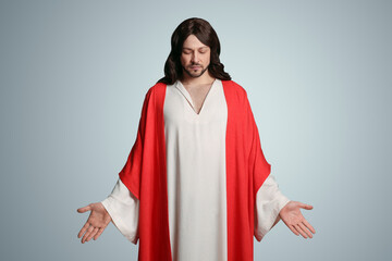 Wall Mural - Jesus Christ with outstretched arms on light grey background