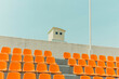 © Jeongho Byeon/Stocksy - The orange color bleachers are empty inside the stadium