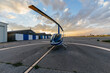 © Marcos Osorio/Stocksy - Small helicopter on the runway