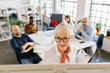 © Mihajlo Ckovric/Stocksy - Businesspeople having a meeting in the office