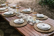 © Ezequiel Giménez/Stocksy - Banquet table served for wedding celebration in nature
