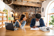 © Valentina Barreto/Stocksy - Young couple teleworking at modern apartment