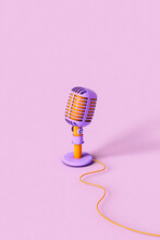 Vertical Image Od A Single Vintage Microphone With An Orange Jack Cable On Violet Background