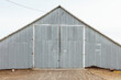 © Rialto Images/Stocksy - Corrugated metal barn and farm building