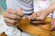 © Tanya Yatsenko/Stocksy - Daddy doing manicure for her daughter