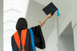 © mnirat - PhD graduate in black gown University bachelor degree.