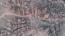 Arial Drone Footage Of White Van Amongst The Massive Rocks Of Alabama Hills In Southern California