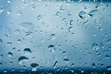 Fototapeta Natura - Rain drops on window glasses surface with sunset. drops on glass spray on window background for dark text view selective focus