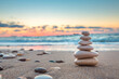 © ValentinValkov - Stones balance on the beach and color sunrise. Zen meditation and relaxation