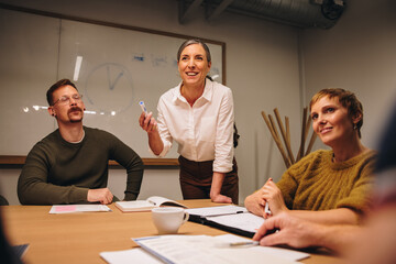 Wall Mural - Manager having meeting with team in boardroom