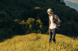 © Shopping King Louie - Hiker walks through the forest, with a backpack, Beautiful wildlife landscape in the forest, Hiking on a hiking trail, Outdoor adventure