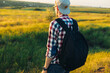 © Shopping King Louie - Portrait of a tourist man walking on a trail in the forest, Strong sporty man traveling with a backpack on the background of the forest