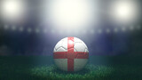 Fototapeta Sport - Soccer ball in flag colors on a bright blurred stadium background. England. 3D image