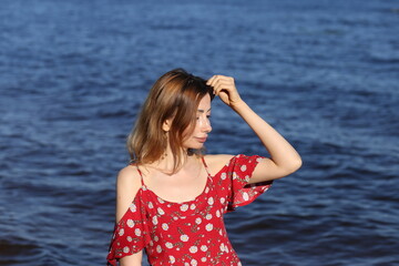 Portrait of beautiful woman in red dress