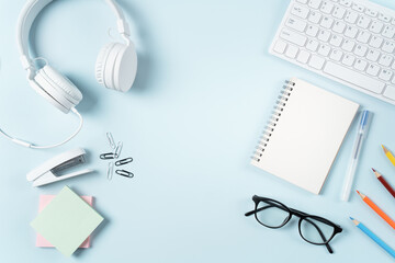 Online learning design concept. Top view of student table with computer, headphone and stationeries.